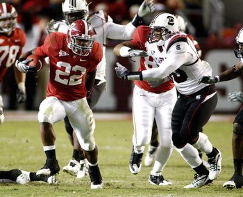 TUSCALOOSA - OCTOBER 17:  Running back Mark Ingram #22 of the Alabama Crimson Tide breaks through the line of scrimmage on a running play during the game against the South Carolina Gamecocks at Bryant-Denny Stadium on October 17, 2009 in Tuscaloosa, Alaba
