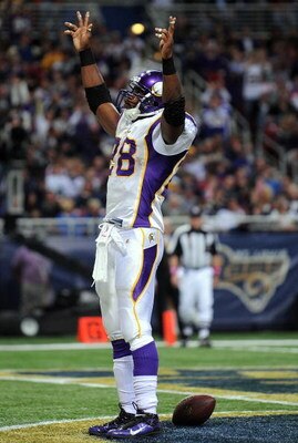 ST. LOUIS - OCTOBER 11:  :  Running back Adrian Peterson #28 of the Minnesota Vikings celebrates his touchdown against the St. Louis Rams at Edward Jones Dome on October 11, 2009 in St. Louis, Missouri.  (Photo by Ronald Martinez/Getty Images)