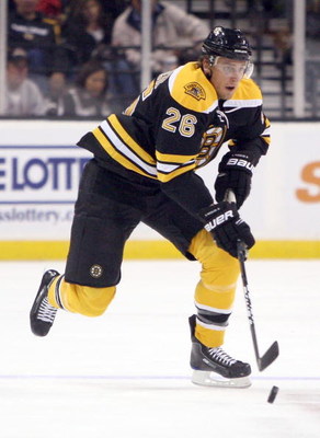 BOSTON, MA - SEPTEMBER 26: Blake Wheeler #26 of the Boston Bruins skates with the puck against the Columbus Blue Jackets at the TD Banknorth Garden on September 26, 2009 in Boston, Massachusetts. (Photo by Jim Rogash/Getty Images)