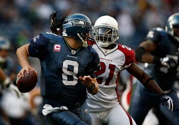 SEATTLE, WA - OCTOBER 18:  Quarterback Matt Hasselbeck #8 of the Seattle Seahawks is pressured by Antrel Rolle #21 of the Arizona Cardinals at Qwest Field on October 18, 2009 in Seattle, Washington.  (Photo by Jonathan Ferrey/Getty Images)
