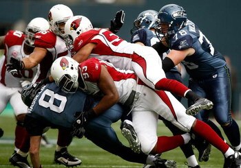 SEATTLE, WA - OCTOBER 18:  Quarterback Matt Hasselbeck #8 of the Seattle Seahawks is sacked by Calais Campbell #93 of the Arizona Cardinals at Qwest Field on October 18, 2009 in Seattle, Washington.  (Photo by Jonathan Ferrey/Getty Images)