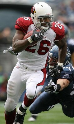 SEATTLE - OCTOBER 18: Running back Beanie Wells #26 of the Arizona Cardinals rushes against Will Herring #54 of the Seattle Seahawks on October 18, 2009 at Qwest Field in Seattle, Washington. (Photo by Otto Greule Jr/Getty Images)