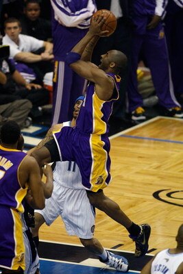 ORLANDO, FL - JUNE 14:  Kobe Bryant #24 of the Los Angeles Lakers goes up for a shot over Courtney Lee #11 of the Orlando Magic in Game Five of the 2009 NBA Finals on June 14, 2009 at Amway Arena in Orlando, Florida.  The Lakers won 99-86.  NOTE TO USER: 
