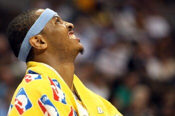 DENVER - MAY 29:  Carmelo Anthony #15 of the Denver Nuggets looks on from the bench in the fourth quarter of Game Six of the Western Conference Finals during the 2009 NBA Playoffs against the Los Angeles Lakers at Pepsi Center on May 29, 2009 in Denver, C