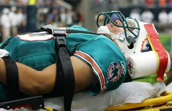 HOUSTON - OCTOBER 07:  Quarterback Trent Green #10 of the Miami Dolphins is taken off the field after an injury during play withthe Houston Texans at Reliant Stadium on October 7, 2007 in Houston, Texas.  (Photo by Ronald Martinez/Getty Images)