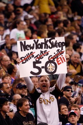 NEW ORLEANS - OCTOBER 18:  A fan celebrates after the New Orleans Saints defeated the New York Giants 48-27 at the Louisiana Superdome on October 18, 2009 in New Orleans, Louisiana.  (Photo by Chris Graythen/Getty Images)