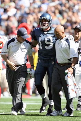 SEATTLE - SEPTEMBER 14:  Logan Payne #19 of the Seattle Seahawks is helped off the field during the game against the San Francisco 49ers on September 14, 2008 at Qwest Field in Seattle Washington. (Photo by Otto Greule Jr/Getty Images) 