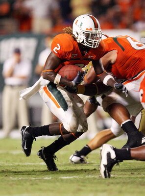 FORT LAUDERDALE, FL - SEPTEMBER 17: Running back Graig Cooper #2 of the Miami Hurricanes looks for room to run while taking on the Georgia Tech Yellow Jackets at Land Shark Stadium on September 17, 2009 in Fort Lauderdale, Florida. Miami defeated Georgia 