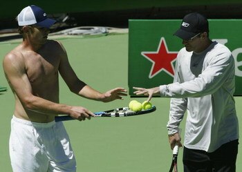 MELBOURNE, AUSTRALIA - JANUARY 15:  Andy Roddick and coach Brad Gilbert of the United States discuss tactics during a training session prior to the 2004 Australian Open at Melbourne Park, January 15, 2004 in Melbourne, Australia. (Photo by Clive Brunskill