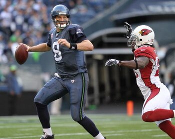 SEATTLE - OCTOBER 18: Quarterback Matt Hasselbeck #8 of the Seattle Seahawks scrambles against Antrel Rolle #21 of the Arizona Cardinals on October 18, 2009 at Qwest Field in Seattle, Washington. The Cardinals defeated the Seahawks 27-3. (Photo by Otto Gr