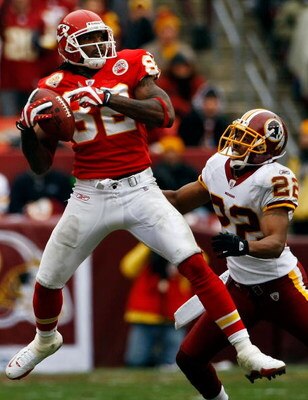 LANDOVER, MD - OCTOBER 18:  Dwayne Bowe #82 of the Kansas City Chiefs catches a pass as Carlos Rogers #22 of the Washington Redskins defends during their game October 18, 2009 at FedEx Field in Landover, Maryland.The Chiefs won the game 14-6.  (Photo by W
