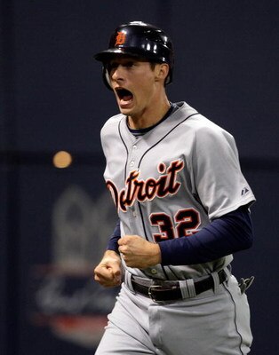 MINNEAPOLIS - OCTOBER 06:  Don Kelly #32 of the Detroit Tigers celebrates after sliding safely into home plate to score during the 10th inning of the American League Tiebreaker game against  the Minnesota Twins on October 6, 2009 at Hubert H. Humphrey Met