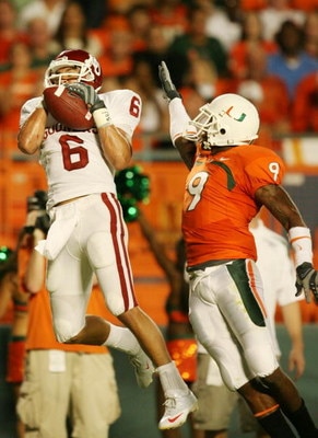 MIAMI GARDENS, FL - OCTOBER 3:  Wide receiver Cameron Kenney #6 of the Oklahoma Sooners catches a pass for a 16-yard touchdown in front of Sam Shields #9 of the Miami Hurricanes during the first quarter of the game on October 3, 2009 at Landshark Stadium 