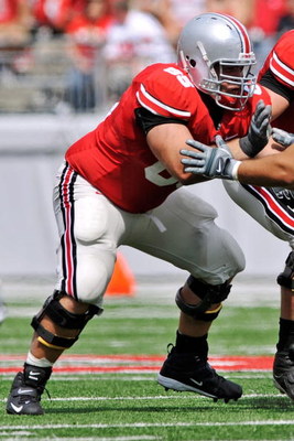 COLUMBUS, OH - SEPTEMBER 05: Offensive lineman Justin Boren #65 of the Ohio State Buckeyes blocks against the Navy Midshipmen at Ohio Stadium on September 5, 2009 in Columbus, Ohio. (Photo by Jamie Sabau/Getty Images)