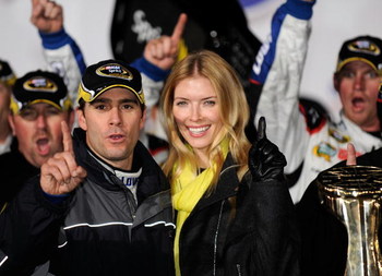 CONCORD, NC - OCTOBER 17: Jimmie Johnson, driver of the #48 Lowe's Chevrolet, celebrates with his wife Chandra after winning the NASCAR Sprint Cup Series NASCAR Banking 500 at Lowe's Motor Speedway on October 17, 2009 in Concord, North Carolina. (Photo