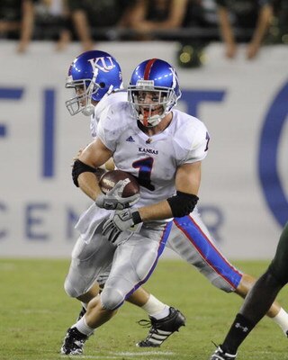 TAMPA, FL - SEPTEMBER 12: Running back Jake Sharp #1 of the Kansas University Jayhawks rushes upfield against the University of South Florida Bulls at Raymond James Stadium on September 12, 2008 in Tampa, Florida.  (Photo by Al Messerschmidt/Getty Images)