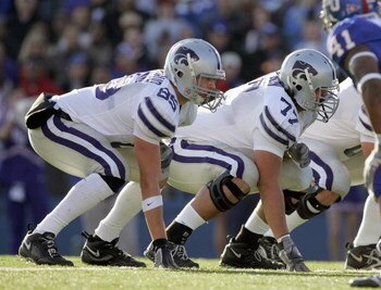 LAWRENCE, KS - NOVEMBER 18: Jeron Mastrud #85 and Michael Frieson # 77 of the Kansas State Wildcats gets ready on the line of scrimmage during the game against the Kansas Jayhawks on November 18, 2006 at Memorial Stadium in Lawrence, Kansas.  Kansas won 3