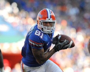 GAINESVILLE, FL - OCTOBER 17: Tight end Aaron Hernandez #81 of the Arkansas Razorbacks rushes upfield with a pass against the Florida Gators October 17, 2009 at Ben Hill Griffin Stadium in Gainesville, Florida.  (Photo by Al Messerschmidt/Getty Images)