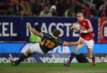 CAPE TOWN, SOUTH AFRICA - JUNE 23:  Shane Wiliams of the Lions makes a break during the match between the Emerging Springboks and the British and Irish Lions as part of their 2009 tour of South Africa at Newlands Stadium on June 23, 2009 in Cape Town, Sou