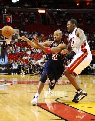 MIAMI - NOVEMBER 10:  Jarvis Hayes #22 of the New Jersey Nets passes the ball off as he is guarded by Yakhouba Diawara #9 of the Miami Heat at American Airlines Arena on November 10, 2008 in Miami, Florida. NOTE TO USER: User expressly acknowledges and ag