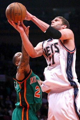 NEW YORK - MARCH 18: Brook Lopez #11 of the New Jersey Nets shoots over Wilson Chandler #21 of the New York Knicks at Madison Square Garden March 18, 2009 in New York City. NOTE TO USER: User expressly acknowledges and agrees that, by downloading and/or u