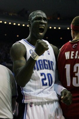 ORLANDO, FL - MAY 24:  Mickael Pietrus #20 of the Orlando Magic celebrates drawing a sixth foul from Delonte West #13 of the Cleveland Cavaliers against in Game Three of the Eastern Conference Finals during the 2009 NBA Playoffs at the the Amway Arena on 
