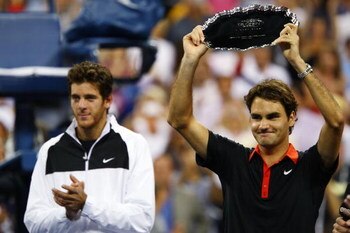 NEW YORK - SEPTEMBER 14:  (L-R) Juan Martin Del Potro of Argentina and Roger Federer of Switzerland pose with their trophies after the Men's Singles final on day fifteen of the 2009 U.S. Open at the USTA Billie Jean King National Tennis Center on Septembe