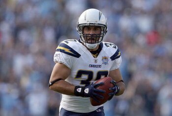 SAN DIEGO, CA - SEPTEMBER 27:  Free-Safety Eric Weddle #32 of the San Diego Chargers intercepts the ball and runs in back for a touchdown late in the fourth quarter against the Miami Dolphins at Qualcomm Stadium on September 27, 2009 in San Diego, Califor