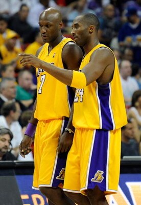 LAS VEGAS - OCTOBER 15:  Lamar Odom #7 and Kobe Bryant #24 of the Los Angeles Lakers walk to the bench during their preseason game against the Sacramento Kings at the Thomas & Mack Center October 15, 2009 in Las Vegas, Nevada. NOTE TO USER: User expressly