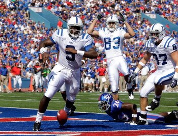 LAWRENCE, KS - SEPTEMBER 19:  Quarterback Thaddeus Lewis #9 of the Duke Blue Devils crosses the goal line for a touchdown during the 1st half of the game against the Kansas Jayhawks at Kivisto Field at Memorial Stadium on September 19, 2009 in Lawrence, K