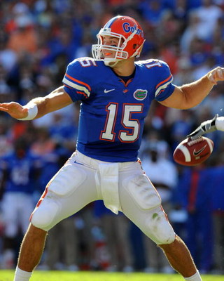 GAINESVILLE, FL - OCTOBER 17: Quarterback Tim Tebow #15 of the Florida Gators fumbles before passing in the first quarter against the University of Arkansas Razorbacks October 17, 2009 at Ben Hill Griffin Stadium in Gainesville, Florida. (Photo by Al Mes