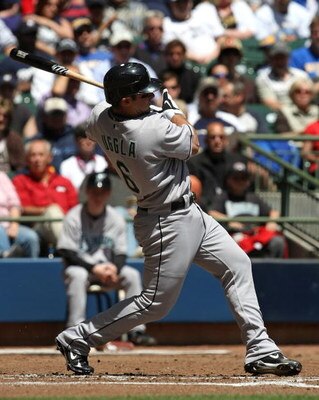 MILWAUKEE - MAY 14: Dan Uggla #6 of the Florida Marlins hits the ball against the Milwaukee Brewers on May 14, 2009 at Miller Park in Milwaukee, Wisconsin. The Brewers defeated the Marlins 5-3. (Photo by Jonathan Daniel/Getty Images)