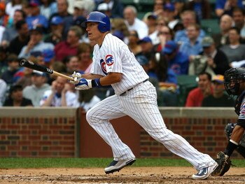 CHICAGO - AUGUST 28: Jeff Baker #28 of the Chicago Cubs hits the ball against the New York Mets on August 28, 2009 at Wrigley Field in Chicago, Illinois. The Cubs defeated the Mets 5-2. (Photo by Jonathan Daniel/Getty Images)