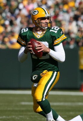 GREEN BAY, WI - OCTOBER 18: Aaron Rodgers #12 of the Green Bay Packers looks for a receiver during a game against the Detroit Lions at Lambeau Field on October 18, 2009 in Green Bay, Wisconsin. The Packers defeated the Lions 26-0. (Photo by Jonathan Danie