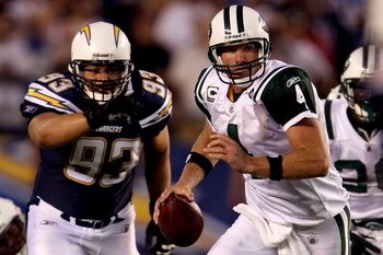 SAN DIEGO - SEPTEMBER 22:  Brett Favre #4 of the New York Jets looks to pass the ball as he is chased by Luis Castillo #93 of the San Diego Chargers on September 22, 2008 at Qualcomm Stadium in San Diego, California.  (Photo by Stephen Dunn/Getty Images)