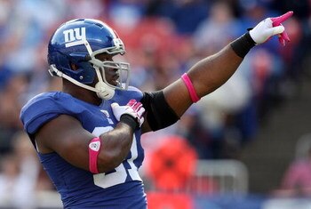 EAST RUTHERFORD, NJ - OCTOBER 11:  Justin Tuck #91 of the New York Giants celebrates his sack in the third quarter against the Oakland Raiders on October 11, 2009 at Giants Stadium in East Rutherford, New Jersey. The Giants defeated the Raiders 44-7.  (Ph
