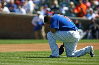 CHICAGO - AUGUST 30: Carlos Zambrano #38 of the Chicago Cubs takes a moment to himself before the first pitch against the New York Mets on August 30, 2009 at Wrigley Field in Chicago, Illinois. The Mets defeated the Cubs 4-1. (Photo by Jonathan Daniel/Get