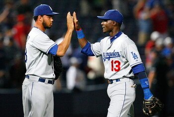 ATLANTA - AUGUST 02:  Orlando Hudson #13 of the Los Angeles Dodgers congratulates closer Ramon Troncoso #38 after a 9-1 win over the Atlanta Braves on August 2, 2009 at Turner Field in Atlanta, Georgia.  (Photo by Kevin C. Cox/Getty Images)