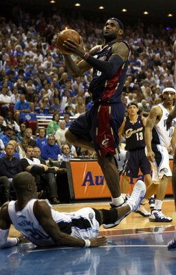 ORLANDO, FL - MAY 30: LeBron James #23 of the Cleveland Cavaliers drives to the hoop over Mickael Pietrus #20 of the Orlando Magic in Game Six of the Eastern Conference Finals during the 2009 Playoffs at Amway Arena on May 30, 2009 in Orlando, Florida. NO