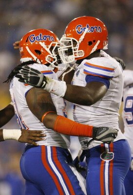 LEXINGTON, KY - SEPTEMBER 26:   Defensive end Carlos Dunlap #8 of the Florida Gators celebrates with teammate Brandon Spikes #51 after Dunlop sacked quarterback Mike Hartline #5 of the Kentucky Wildcats during the third quarter of the game at Commonwealth