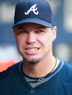 NEW YORK - AUGUST 20:  Chipper Jones #10 of the Atlanta Braves watches batting practice prior to the game against the New York Mets on August 20, 2009 at Citi Field in the Flushing neighborhood of the Queens borough of New York City.  (Photo by Jared Wick