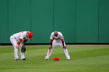 WASHINGTON - AUGUST 06:  Leftfielder Josh Willingham #16 and centerfielder Nyjer Morgan #1 of the Washington Nationals await a pitching change against the Florida Marlins at Nationals Park on August 6, 2009 in Washington, DC. The Nationals defeated the Ma