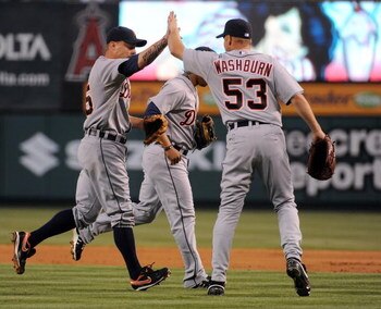 ANAHEIM, CA - AUGUST 25:  Jarrod Washburn #53 of the Detroit Tigers gives a high five to Brandon Inge #15 for his diving play to start a double play against the Los Angeles Angels of Anaheim during the first inning at Angel Stadium of Anaheim on August 25
