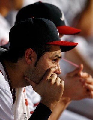 ATLANTA - JUNE 26:  Pitcher Mike Gonzalez #51 of the Atlanta Braves looks on from the dugout in the bottom of the ninth inning against the Boston Red Sox at Turner Field on June 26, 2009 in Atlanta, Georgia.  (Photo by Kevin C. Cox/Getty Images)