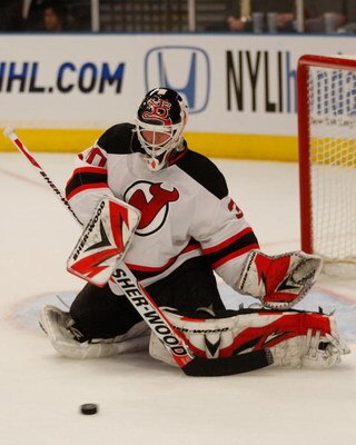 NEW YORK - OCTOBER 22: Martin Brodeur #30 of the New Jersey Devils makes a stop against the New York Rangers during the game on October 22, 2009 at Madison Square Garden in New York City. (Photo by Jared Wickerham/Getty Images)