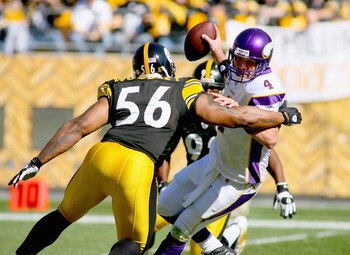 PITTSBURGH - OCTOBER 25: Brett Favre #4 of the Minnesota Vikings is trapped by LaMarr Woodley #56 and James Harrison #92 of the Pittsburgh Steelers at Heinz Field on October 25, 2009 in Pittsburgh, Pennsylvania.  (Photo by Rick Stewart/Getty Images)