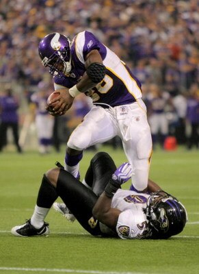 MINNEAPOLIS - OCTOBER 18:  Running back Adrian Peterson #28 of the Minnesota Vikings rushes and is tackled by Dannell Ellerbe #59 of the Baltimore Ravens during NFL action at Hubert H. Humphrey Metrodome on October 18, 2009 in Minneapolis, Minnesota. The 