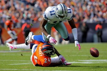 DENVER - OCTOBER 04:  Champ Bailey #24 of the Denver Broncos breaks up a pass intended for Roy Williams #11 of the Dallas Cowboys during NFL action at Invesco Field at Mile High on October 4, 2009 in Denver, Colorado. The Broncos defeated the Cowboys 17-1