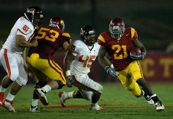 LOS ANGELES, CA - OCTOBER 24:  Running back Allen Bradford #21 of the USC Trojans breaks away from  linebacker David Pa'aluhi #45 of the Oregon State Beavers  on a 43 yard touchdown run in the third quarter on October 24, 2009 at the Los Angeles Coliseum 