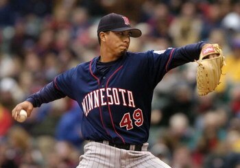 CLEVELAND - APRIL 12:  Kyle Lohse #49 of the Minnesota Twins delivers a pitch to the Cleveland Indians on April 12, 2004 at Jacobs Field in Cleveland, Ohio. Cleveland defeated Minnesota 6-3 in their home opener.  (Photo by David Maxwell/Getty Images)